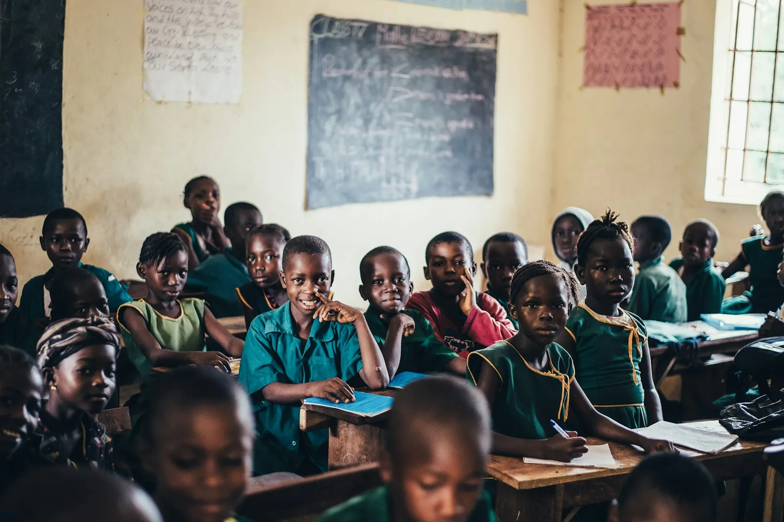 Girl at her desk in a busy classroom