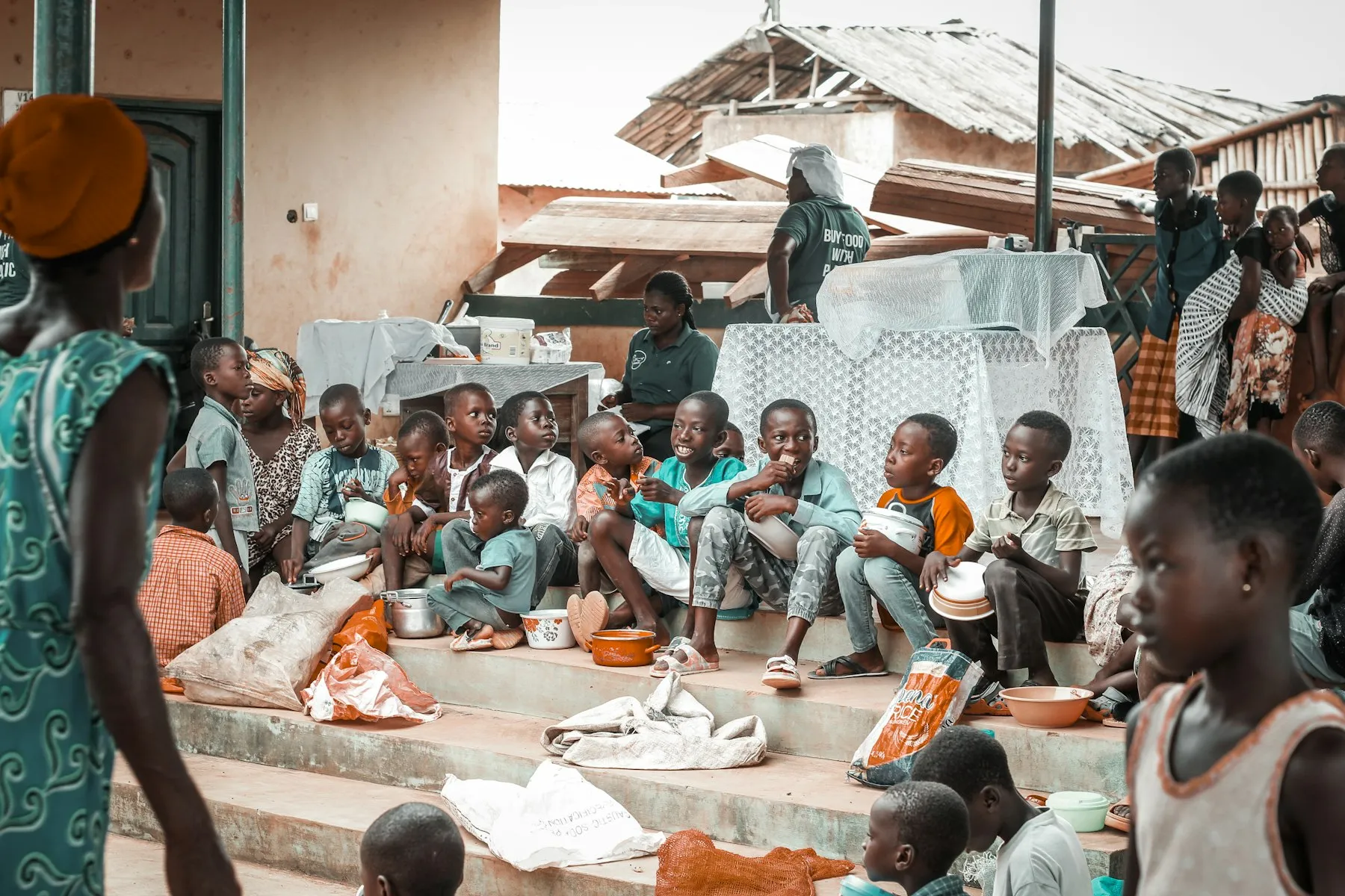Children sitting together on school steps