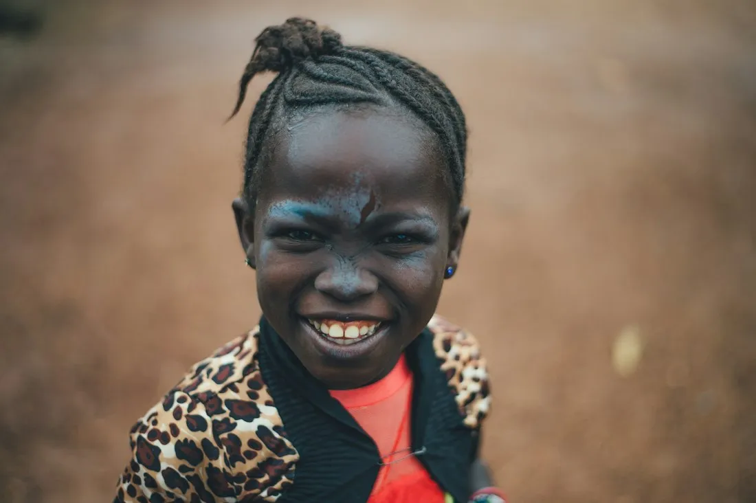 Child grinning at the camera