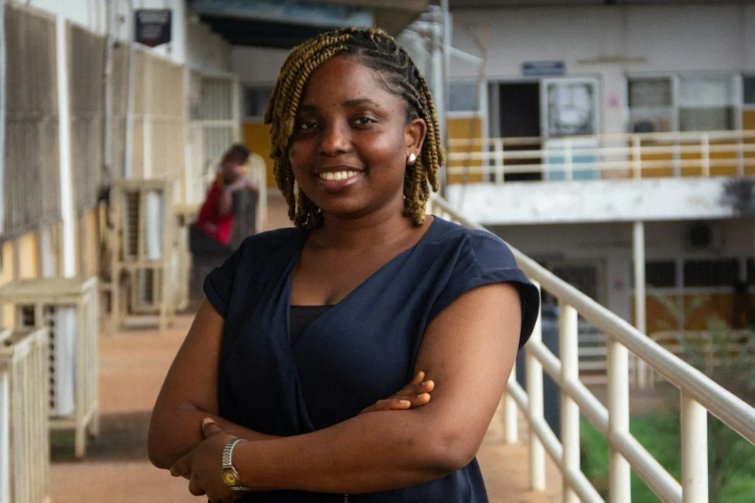 Young woman with braids smiling confidently
